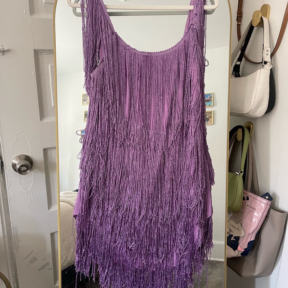 Pretty Tina solid color rocking tassel backless mini dress